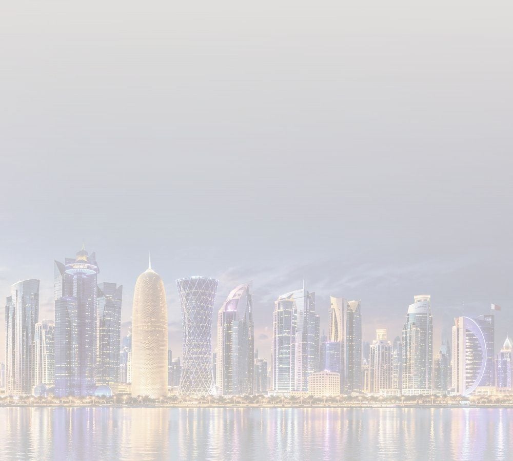 Doha skyline at twilight across the bay, with a traditional dhow on the water